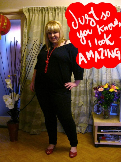 Photo of a blonde me wearing black skinny jeans and a baggy black top and a photoshopped speech bubble saying "Just so you know I look amazing".