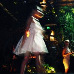 More impressionism - possibly one of Degas' dancers! A model wears a short white dress with a full skirt and a large bow at the bust.