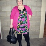 Bringing some colour out Natalie wearing an Evans floral dress, pink cardigan, black tights and black boots.