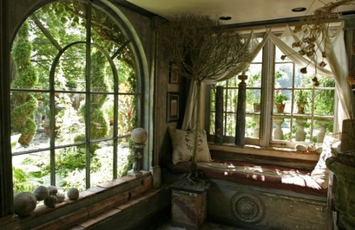 Inside Michael Trapp's home A photo of two adjacent walls with two big old windows with a gorgeous view to a green garden.