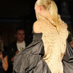 Danielle Van Camp The model's back is to us, we see a cream smocked top and black billowing sleeves that sit on the upper arm and finish at the wrist.