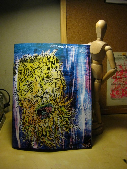 Eat Sleep Draw Cover of Eat Sleep Draw magazine - features a yellow gruesome illustration on a blue background.