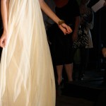LUELA Detail of model's skirt - long white and flowing.