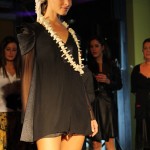 USCARI Model wearing a black and grey dress with a necklace that looks like vertibrae!