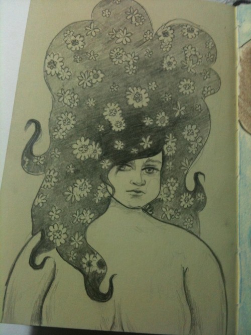 Pencil illustration in sketchbook of a chubby girl with big hair with flowers in it.