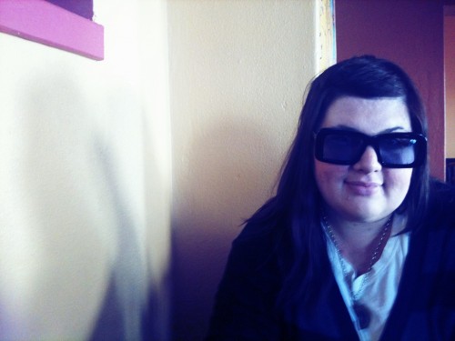Photo of me wearing the big squarish Karen Walker sunglasses.