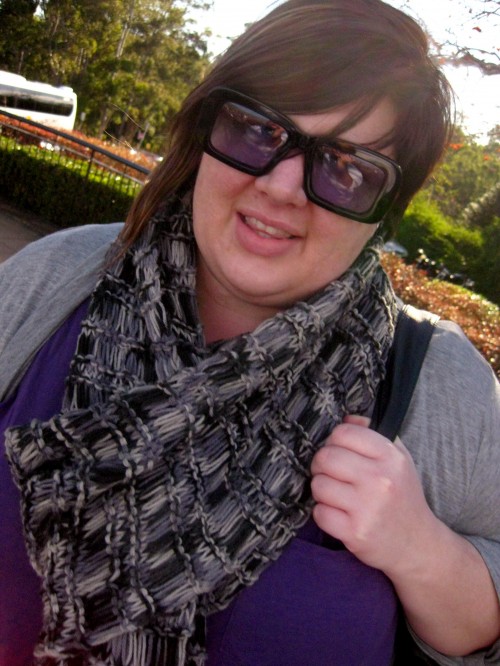 An awkward close up shot of me. My sunglasses have purple lenses and they match my tshirt!