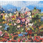 A puzzle that looks to be of sky and mountains but explodes with the colour of lots of different flowers.