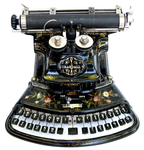 A beautiful and ornately decorated Crandall typewriter, it has a wonderful curved and ornate Victorian design and is lavishly decorated with hand painted roses, accented with inlaid mother-of-pearl!