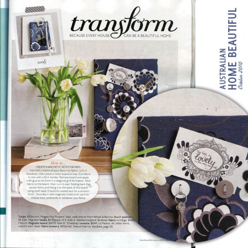 Scan of Home Beautiful magazine: Heading says "transform" and shows a vase of flowers next to a blue fabic covered noticeboard. An inset photo shows detail of the noticeboard, and my postcard is attached to it. The postcard says "You look as lovely as the day we met."