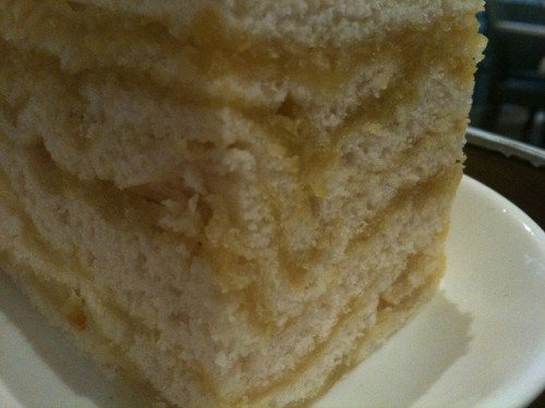 Macro shot of the thousand layer cake - lots of cake layers with yellow wintermelon in between.