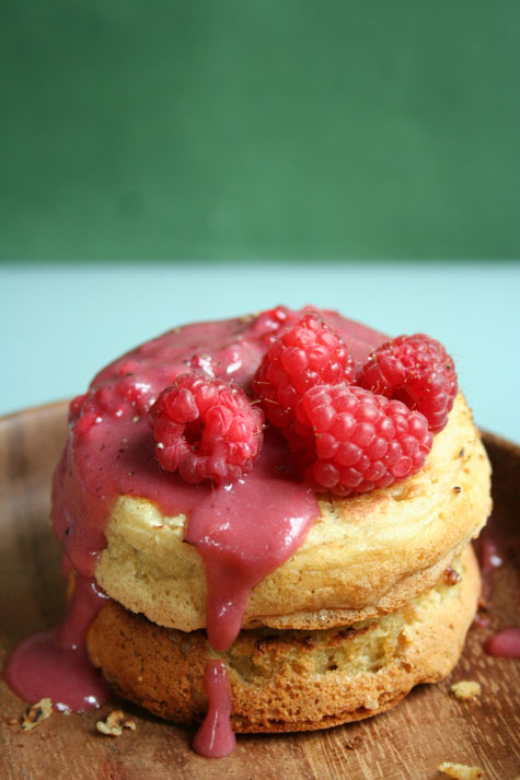 Home made crumpets with a raspberry sauce drizzled on top.