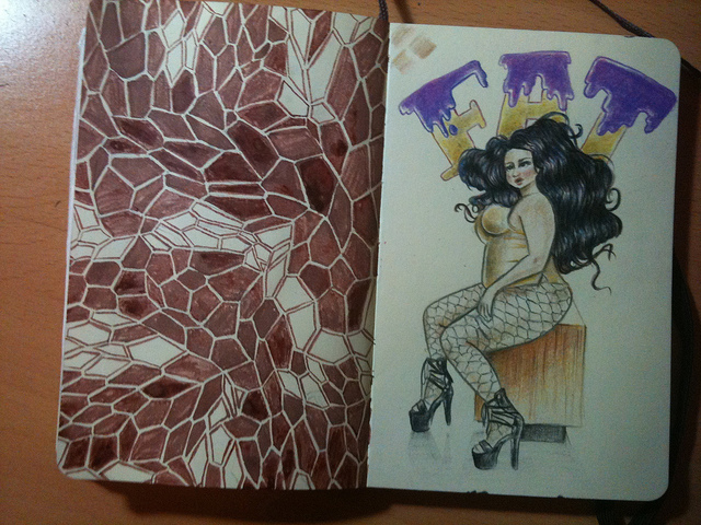 Photo of two pages in a moleskine, left has a crystal-fragment like pattern painted in burnt sienna ink; the right page has a pencil drawing of a fat woman wearing a gold leotard, fishnet stockings and shiny black high heels with the word "FAT" written behind her, the letters dripping with purple icing.