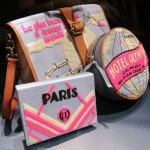 A photo of a collection of felt book covers and bags in fluoro pink, grey and cream. They have an art deco flair.