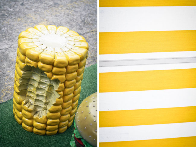 Collage of two photos: left is a giant cord on the cob used as a stool to sit on, there's a chunk of it been "bitten" off!; right is a detail shot of the canvas awning which is yellow and white striped.