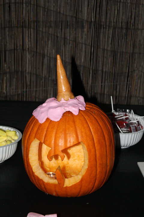 Photo of a pumpkin with the Wu Tang logo carved into it, with a melted ice cream and cone sitting on top (from Nick's Ralph Wiggins cosume.)