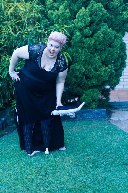 Outfit photo of me wearing the Ursula costume and bending over to pick up a tentacle. 