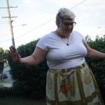 A photo in the garden of me with my hands out, maybe dancing?