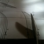 A photo of my scissors cutting along the dashed line that indicates the size 54 pattern.