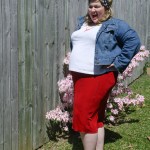 A side view of me in my outfit, as I pull a gleeful face.