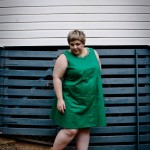 An outfit photo of me wearing my short sleeveless green dress with circle collar made out of a patterned green cotton.