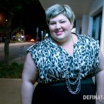 A photo of me smiling on a quiet Gold Coast street at night. I have new shorter hair!