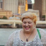 Me closing my eyes and cheesing for the camera, the city behind me looking rather golden.