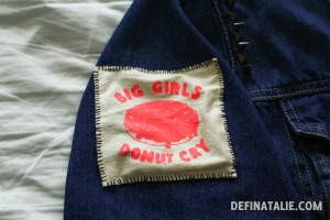 A photo of my fluro red patch stitched on to the sleeve of my denim jacket.