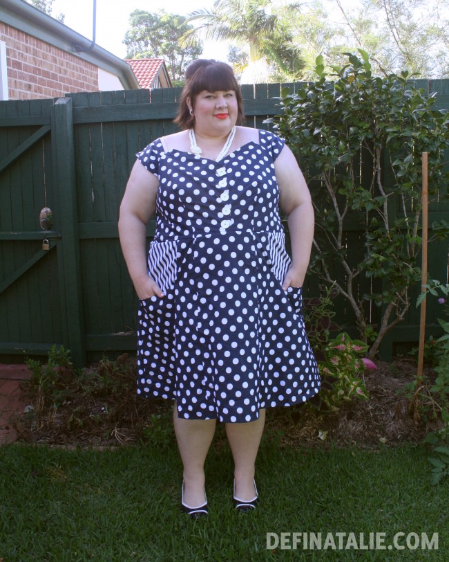 Modelling my new handmade dress in navy polka dots with striped pocket lining at the hips.