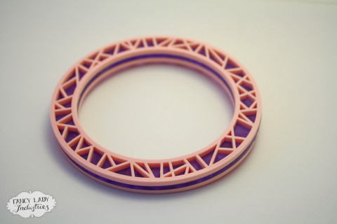 Gem Powa bangle - frosted purple sandwiched between baby pink laser cut acrylic. Also available in black and gold glitter.